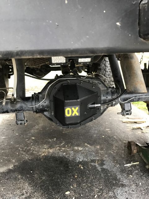 1989 Ford Bronco - Close-up of a rear differential cover an OX logo, likely an aftermarket part.
