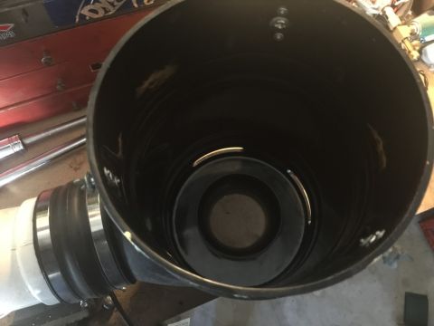 1989 Ford Bronco - This is a close-up, interior view of a large black plastic pipe with a white pipe attached via a rubber coupler and metal clamps. Inside th…