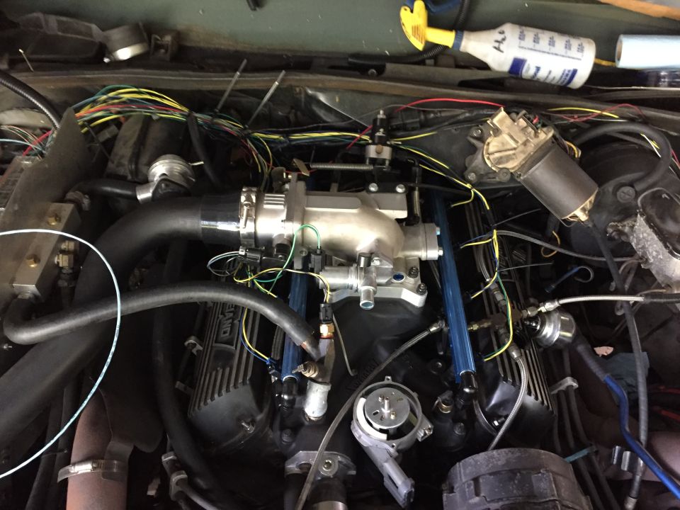 Most of the fuel injection wiring harness installed. Took a long time but I tracked down factory connectors and terminals for every thing. There are no pigtails and almost no splices in the entire harness. It's just loosely zip-tied here but I'll pull the whole thing and properly wrap it.