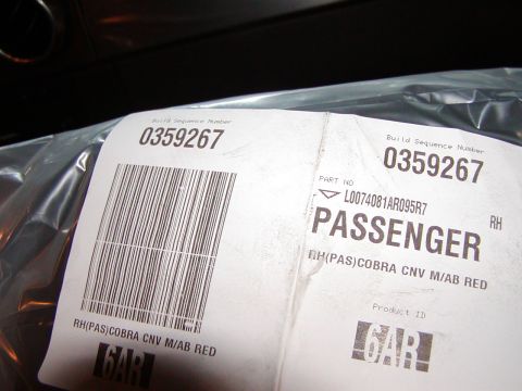 2007 Ford Mustang - Close-up of labels on a vehicle part, indicating it's for the passenger side and includes build sequence and part numbers.