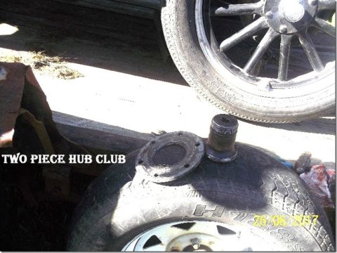 1909 Ford Model T - A close-up shows a disassembled hub and a tire with visible text and a date stamp.