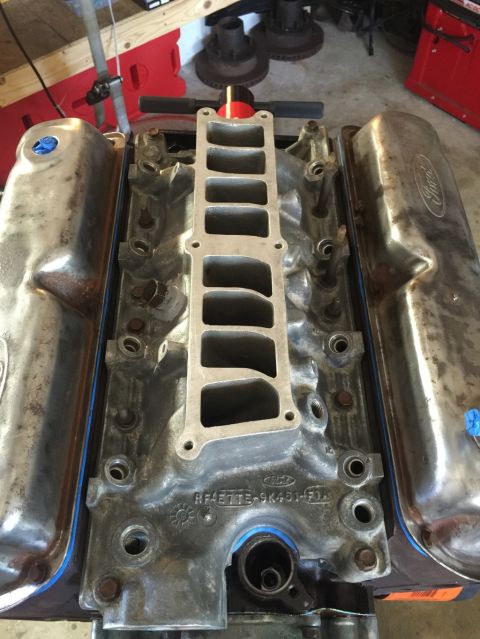 1989 Ford Bronco - Close-up of a Ford engine's intake manifold and valve covers, showing engine part details.