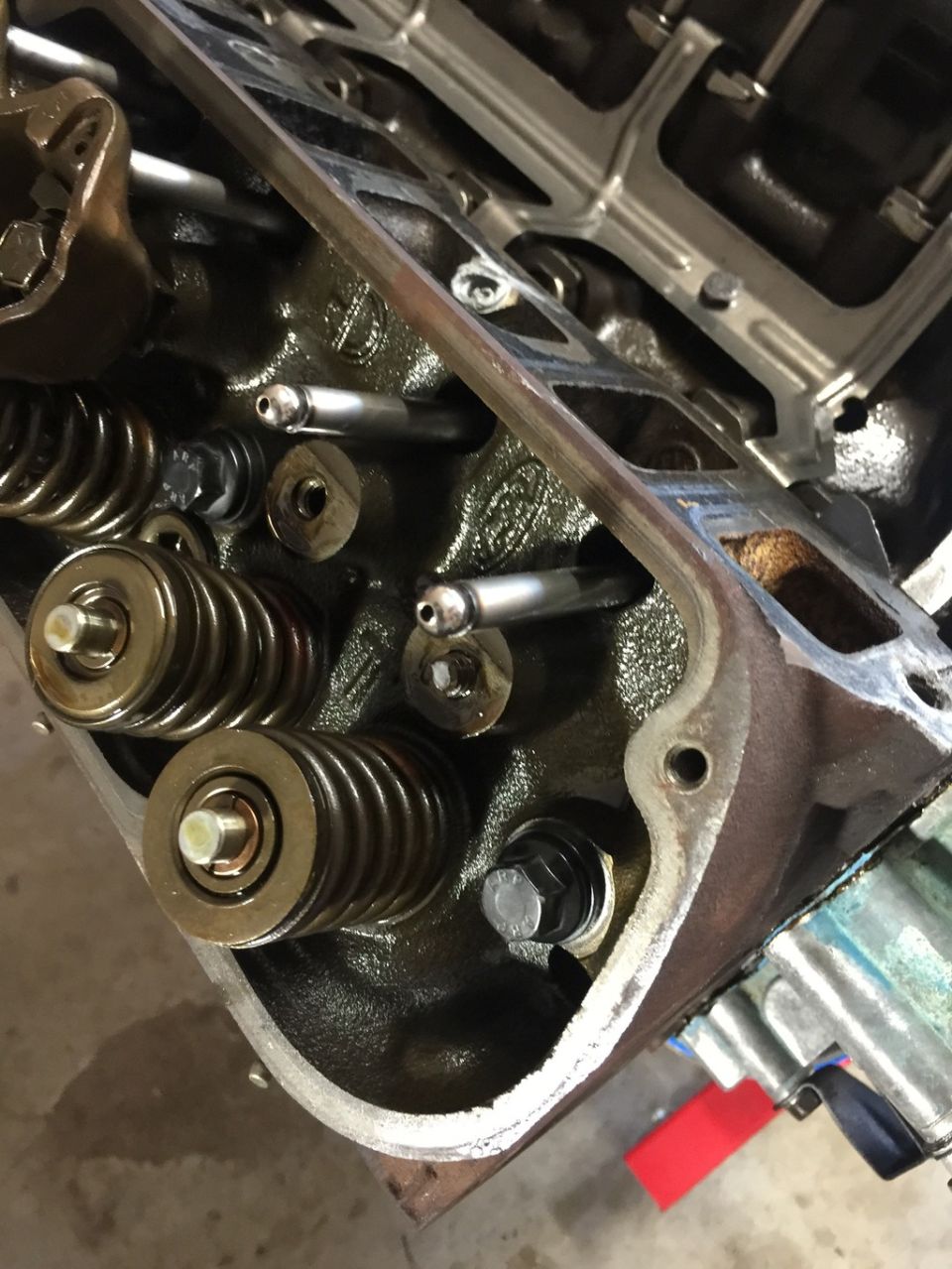 Close-up of engine valve springs, pushrods, and rocker arms