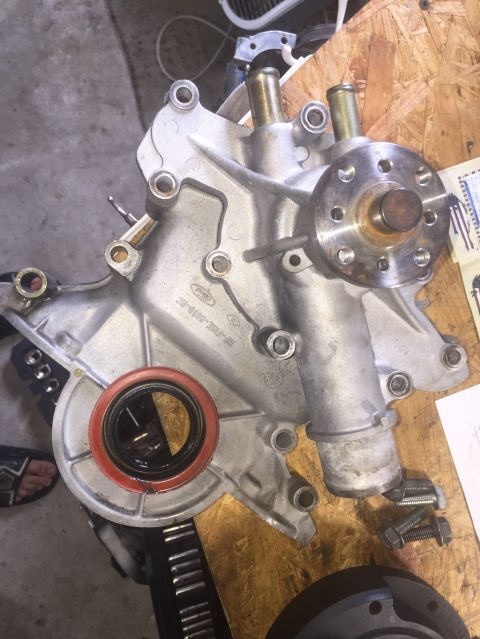1989 Ford Bronco - Ford engine water pump with part number F2TE-8501-AB and a red seal.