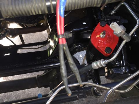 1989 Ford Bronco - Engine oil filter housing with associated plumbing and wiring, likely part of an engine bay.