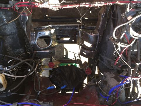 1989 Ford Bronco - This is the engine bay of a vehicle undergoing repairs or modification, with many components disassembled.