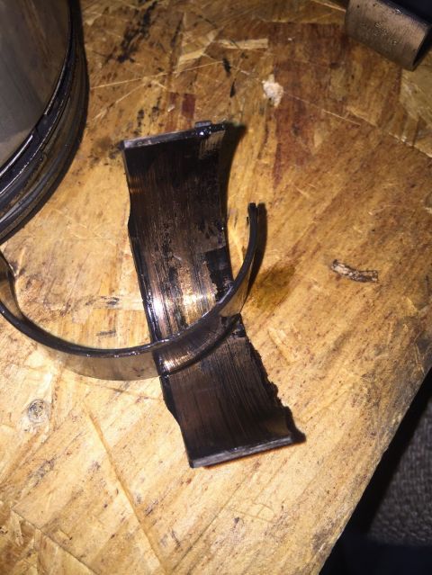 1989 Ford Bronco - This damaged engine bearing shows signs of significant wear and potential failure.