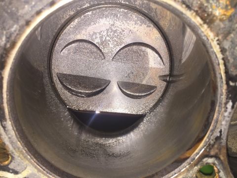 1989 Ford Bronco - Close-up view inside an engine cylinder, revealing the piston and a .040 measurement marking.