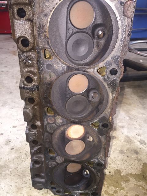 1989 Ford Bronco - Close-up view of an engine cylinder head, showing the intake and exhaust valves.