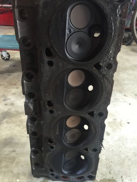 1989 Ford Bronco - This is a close-up view of an engine's cylinder head, showing the combustion chambers and valves.