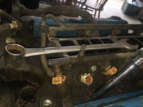 1989 Ford Bronco - Tools are placed on engine parts, suggesting ongoing maintenance or repair work.