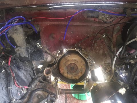1989 Ford Bronco - The engine bay is exposed, with the transmission bell housing visible and the engine removed.
