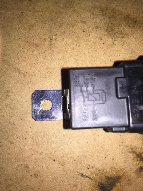 1989 Ford Bronco - A single automotive relay is shown with its internal circuit diagram visible on the casing.