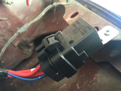 1989 Ford Bronco - Close-up of an automotive relay with wiring, showing part numbers and a circuit diagram.