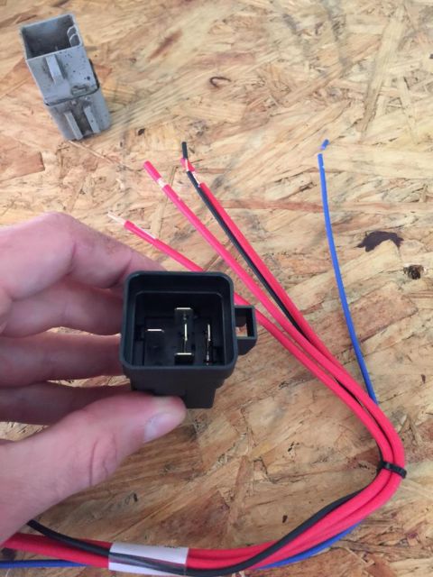 1989 Ford Bronco - Close-up of an automotive relay and wiring harness, likely for replacement or repair.