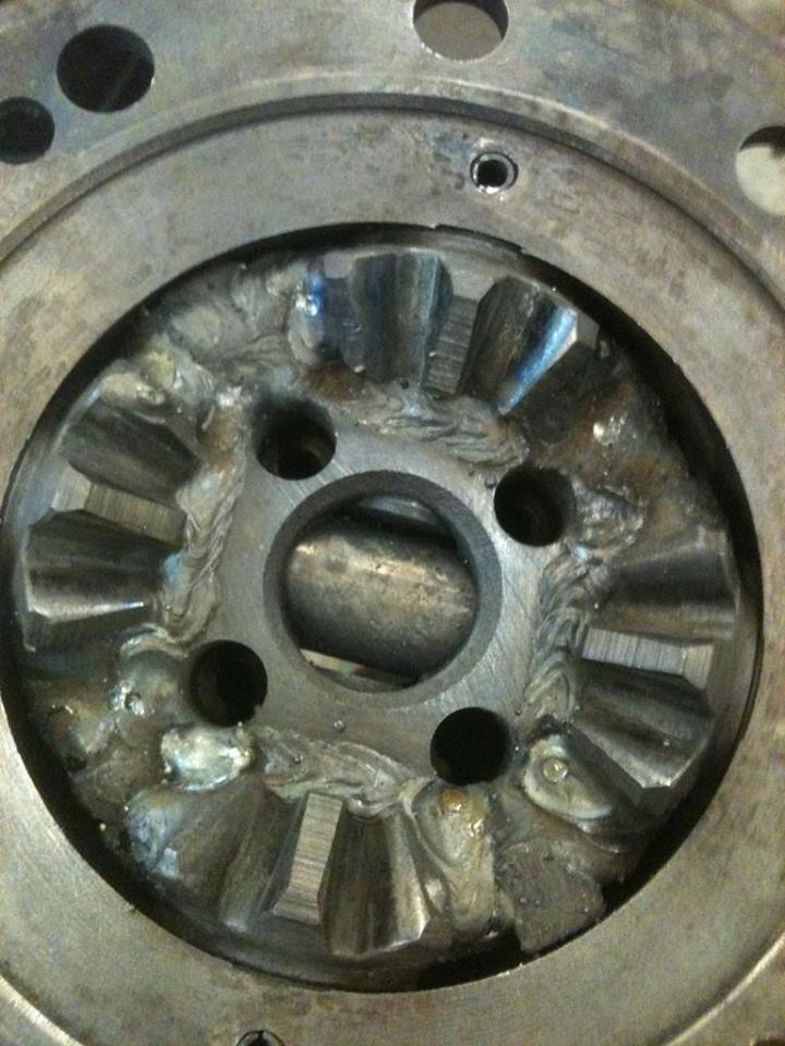 Welded differential gears in a vehicle axle housing.