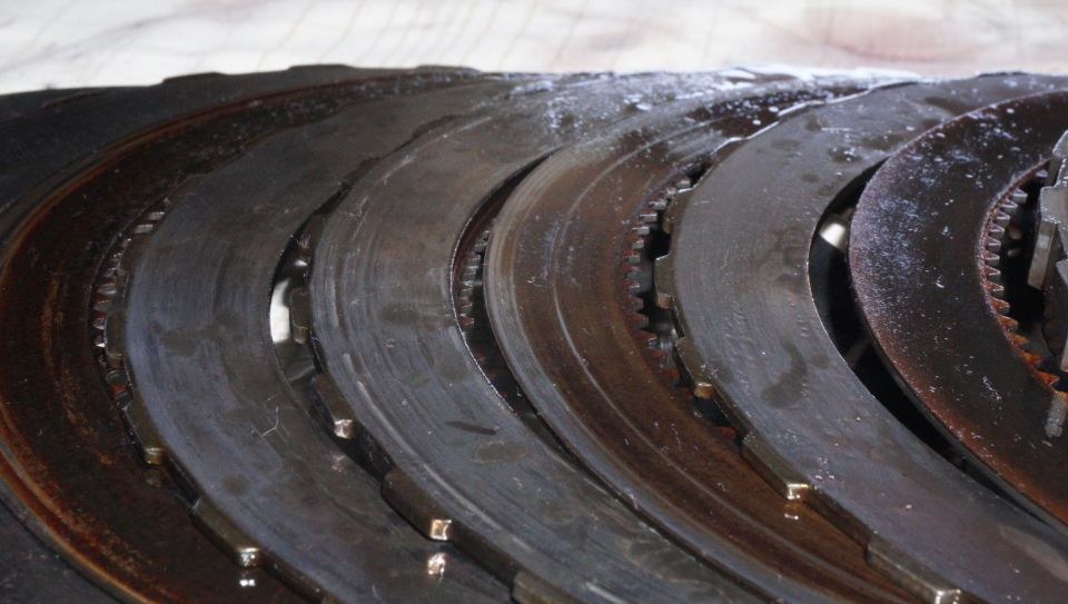 Clutch plates with visible wear and oil