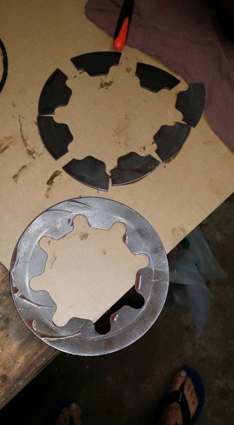 1984 Ford Bronco - Two sets of clutch plates are shown, one disassembled and the other intact.