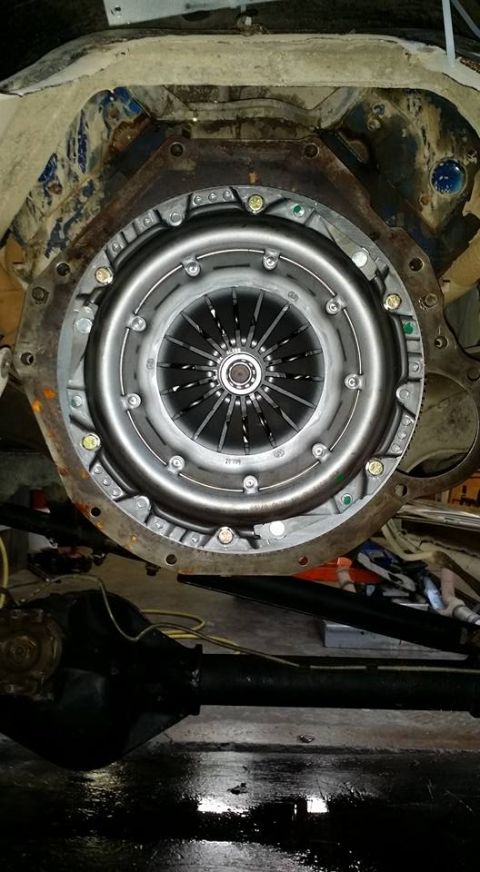 1984 Ford Bronco - Close-up of a vehicle's clutch assembly and rear axle, likely during maintenance or repair.