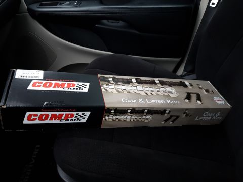 1984 Ford Bronco - Two boxes of Comp Cams Cam & Lifter Kits are placed on a car's back seat.