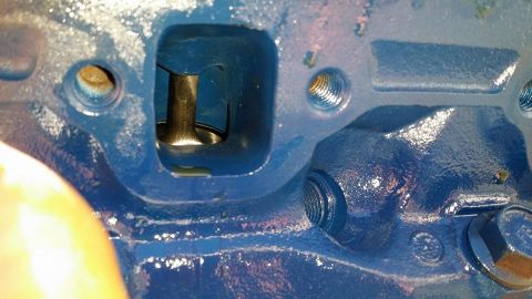 1984 Ford Bronco - A close-up view of an engine's internal components, focusing on a valve within its cylinder head.