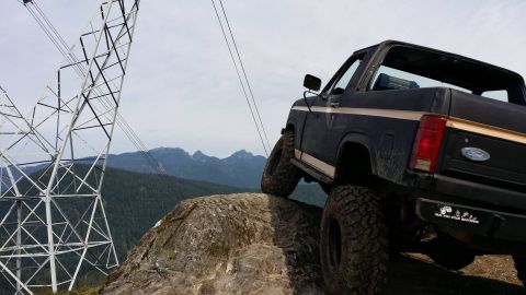 1984 Ford Bronco - This 1984 Ford Bronco is shown off-roading on a rocky mountain trail.