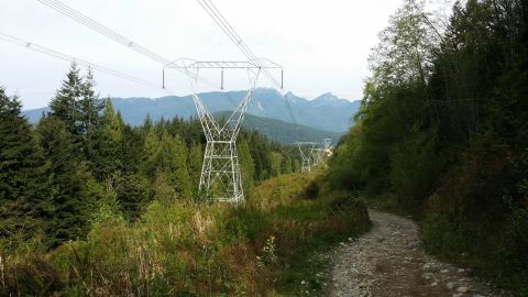 1984 Ford Bronco - A scenic view of a mountain landscape with power line infrastructure.