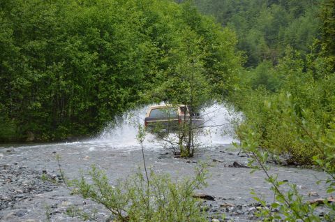 1984 Ford Bronco - This 1984 Ford Bronco is navigating a water crossing in a wooded area.