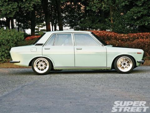 1984 Ford Bronco - This vintage sedan features a clean side profile with chrome trim and aftermarket wheels.