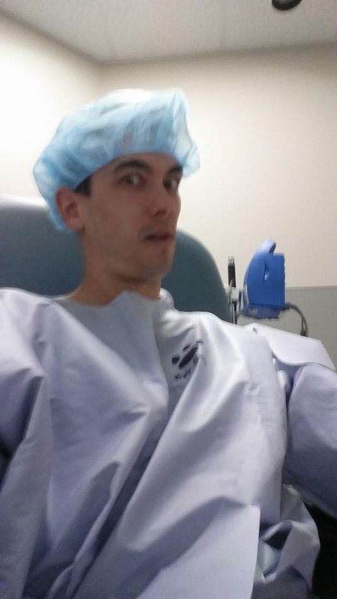 1984 Ford Bronco - Person in surgical cap and gown sits in a chair, looking surprised.