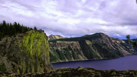 1984 Ford Bronco - View of Crater Lake, Oregon, showing the caldera rim and deep blue water.