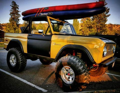 1984 Ford Bronco - This lifted Ford Bronco is ready for an adventure with a kayak secured to its roof rack.