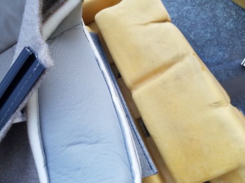 1994 Ford Bronco - Close-up of car seat foam and fabric upholstery, showing construction details.