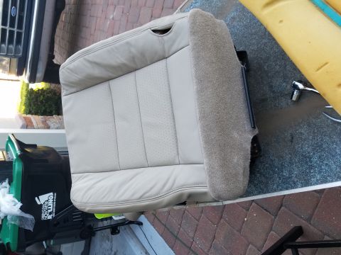 1994 Ford Bronco - Car seat removed from a vehicle, possibly for repair or replacement.