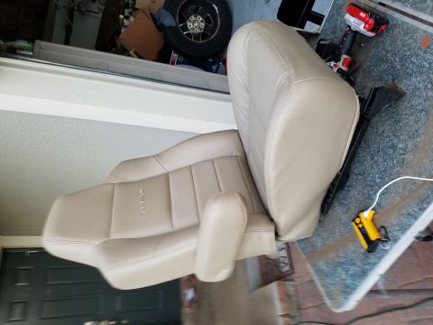 1994 Ford Bronco - Tan leather car seats with 'Lariat' embossed on the side are shown, not a 1994 Ford Bronco.