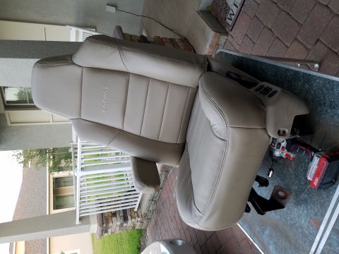 1994 Ford Bronco - Tan leather car seats with 'Lariat' embossed on the headrest are shown, likely from a Ford truck or SUV.