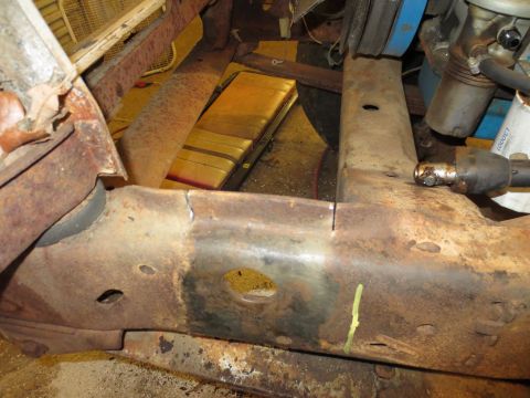 1967 Ford F-250 - Close-up view of a heavily rusted truck frame, showing structural components and some engine parts. The registry claims it's a 1967 Ford F-…