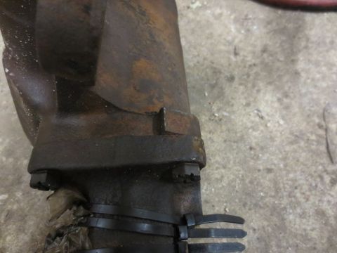 1967 Ford F-250 - This is a close-up view of a rusted metal part, possibly from a vehicle's steering or suspension system.