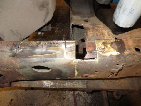 1967 Ford F-250 - This heavily rusted truck frame section shows signs of modification and wear.