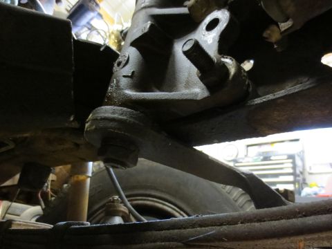 1967 Ford F-250 - Underside view of a vehicle's suspension components, including a steering knuckle and tie rod end.