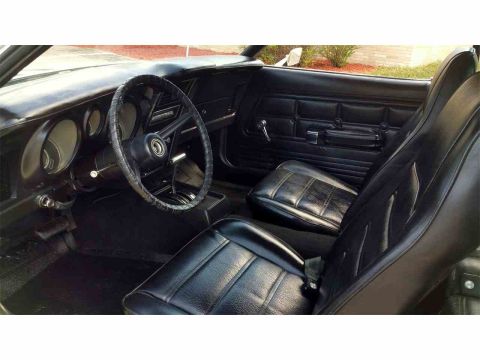 1971 Ford Mustang - Interior view of a 1971 Ford Mustang, showing the dashboard, steering wheel, and front seats.