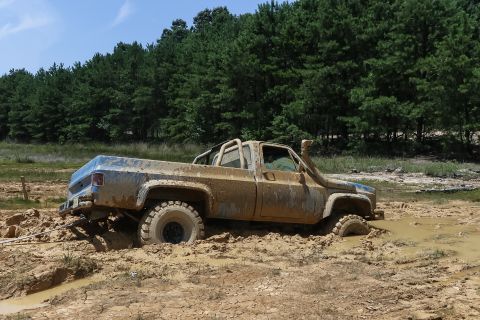 1978 Chevrolet C/K Pickup - This 1978 Chevrolet C/K Pickup is deep in the mud, equipped with a snorkel for off-road adventures.
