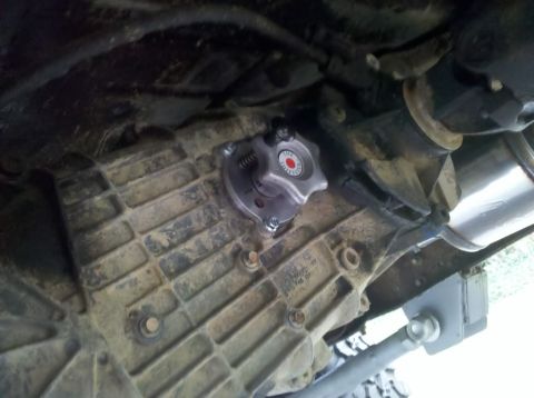 1989 Ford Bronco - Transfer case with a custom shifter knob, likely an aftermarket part for an off-road vehicle.