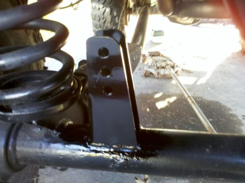 1989 Ford Bronco - Underneath view of vehicle suspension components, possibly during maintenance or modification.