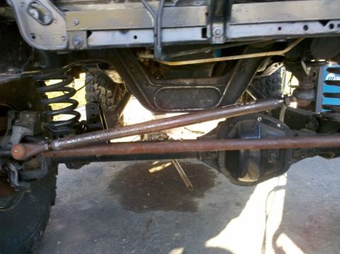 1989 Ford Bronco - Close-up view of the undercarriage, focusing on the suspension and differential components.