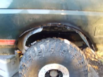 1989 Ford Bronco - This photo shows the wheel well and tire of a vehicle, with visible signs of wear and tear.