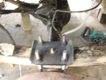 1989 Ford Bronco - Underside view of a vehicle's rear axle assembly with suspension hardware.