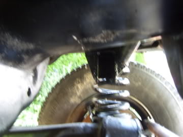 1989 Ford Bronco - Underside view of a vehicle's suspension system, showing a spring and tire. SuperMotors.net logo is present.