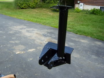1989 Ford Bronco - A black trailer hitch assembly is shown on an asphalt surface with grass and a building in the background.