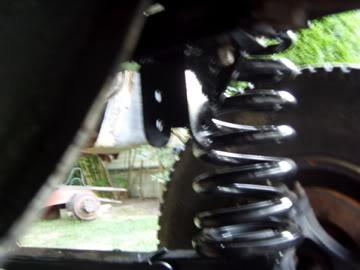 1989 Ford Bronco - Suspension component and tire detail, with SuperMotors branding visible.